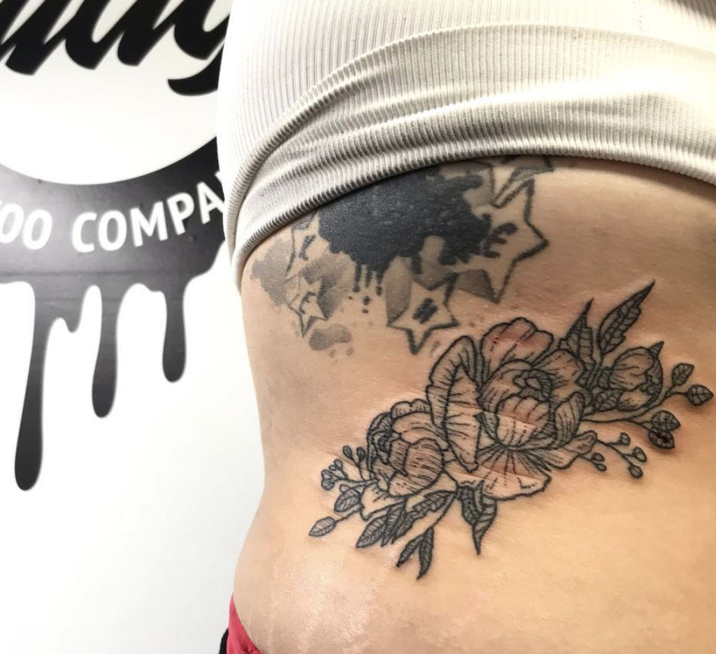 floral rib tattoo