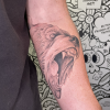 Realism bear forearm tattoo