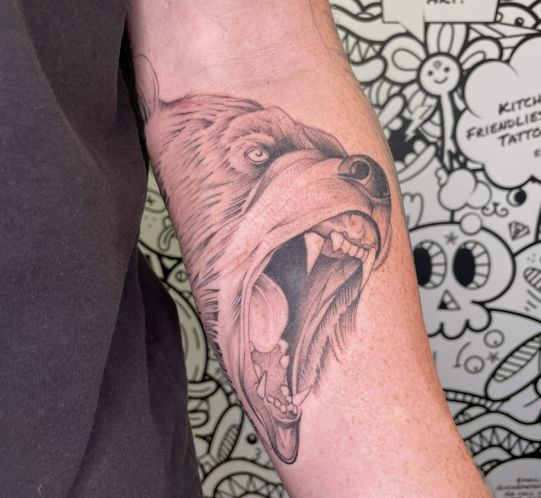 Realism bear forearm tattoo
