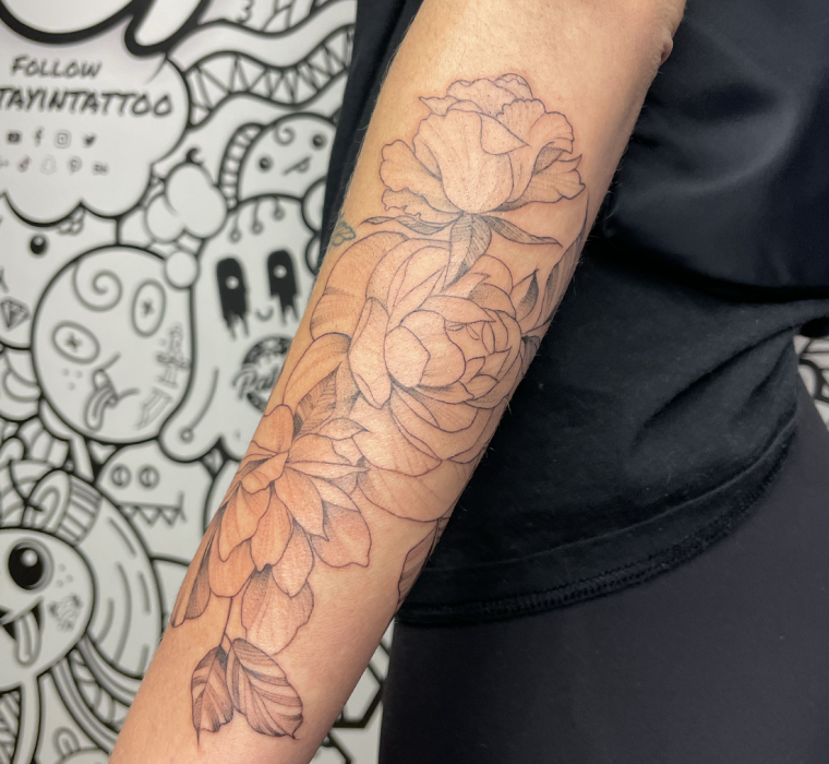 Fine line peonies and floral on forearm.
