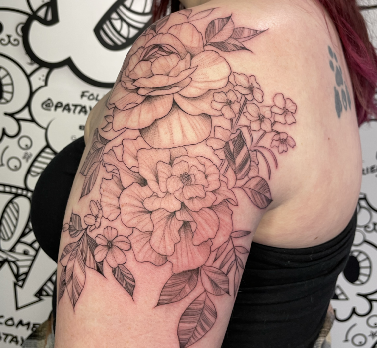 Custom birth flower half-sleeve tattoo