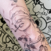 Man with a noose around his neck tattoo.