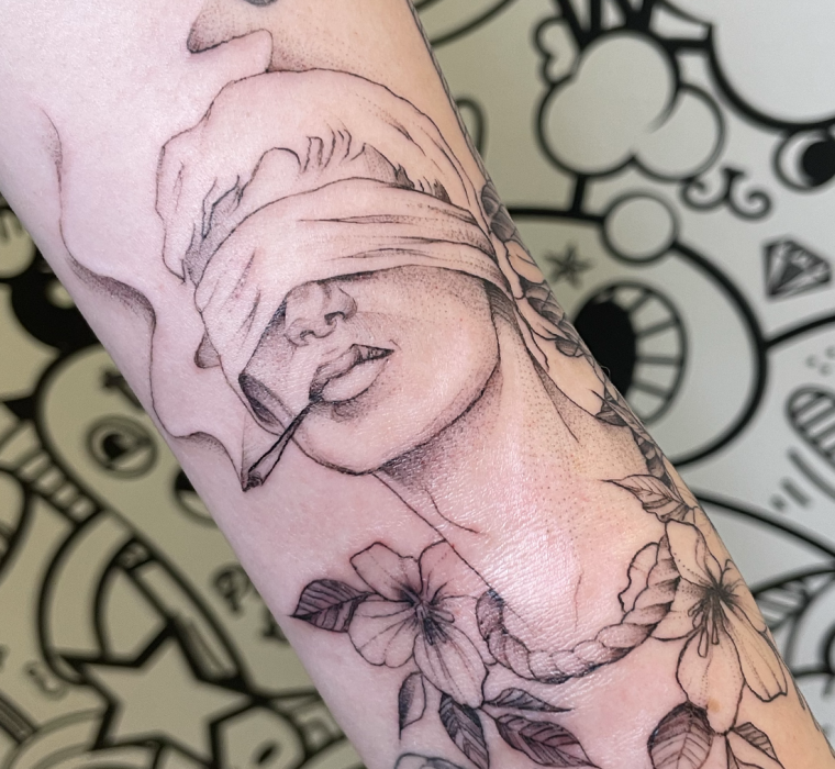 Man with a noose around his neck tattoo.