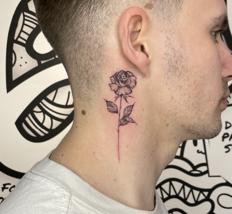 Behind the ear rose/neck tattoo.