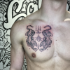 Sakyant chest tattoo