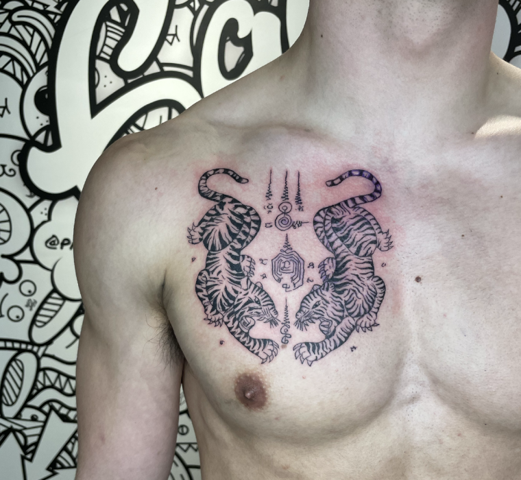 Sakyant chest tattoo