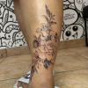 Fine line rose shin tattoo