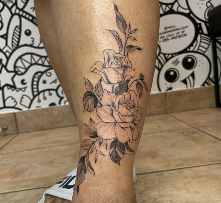 Fine line rose shin tattoo