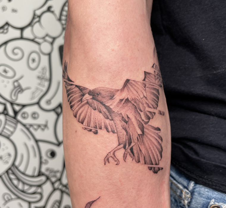 Spliced raven tattoo