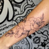 fine-line floral forearmtattoo