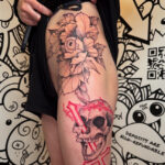 Big and bold hip peony tattoos with skull in black and red