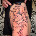 Big and bold hip peony tattoo