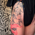 Big and bold hip peony tattoos with snake in black and red
