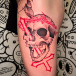 skull with inverted cross in black and red tattoo
