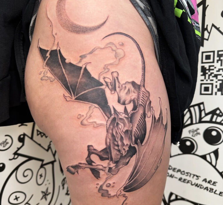 Black and grey flying horse tattoo