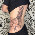 Tiger and floral large hip and back tattoo